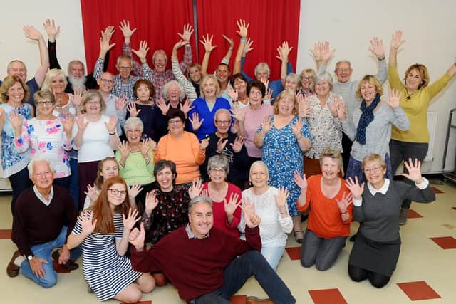 Musical director Andrew Cleary, front, with the Milton Glee Club