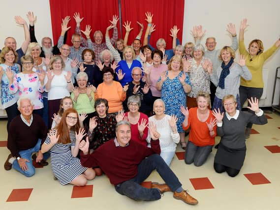 Musical director Andrew Cleary, front, with the Milton Glee Club