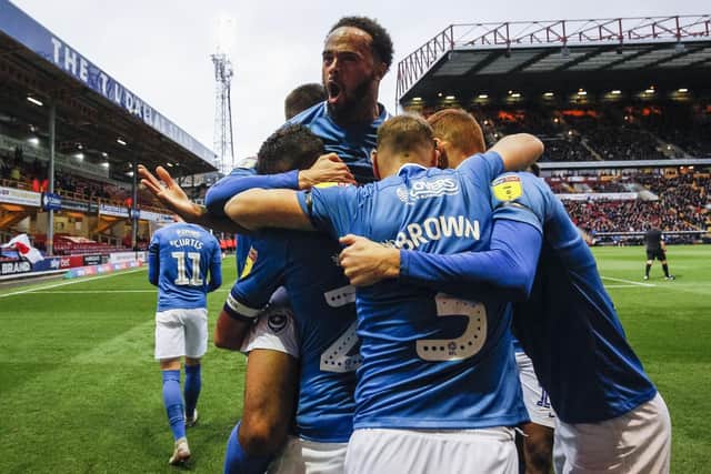The Pompey players celebrate Gareth Evans' winner against Bradford Picture: Daniel Chesterton/phcimages.com