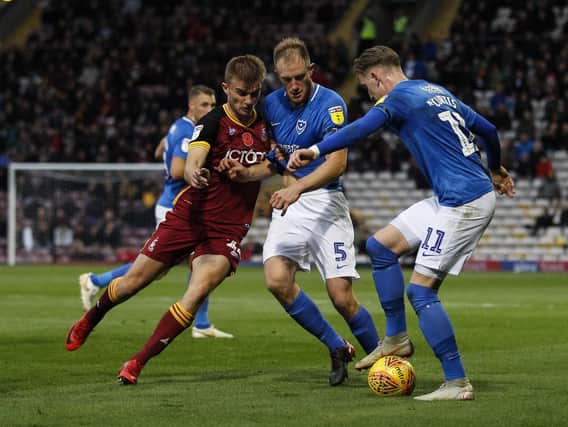 Bradford's George Miller and Pompey's Matt Clarke and Ronan Curtis. Picture: Daniel Chesterton/phcimages.com