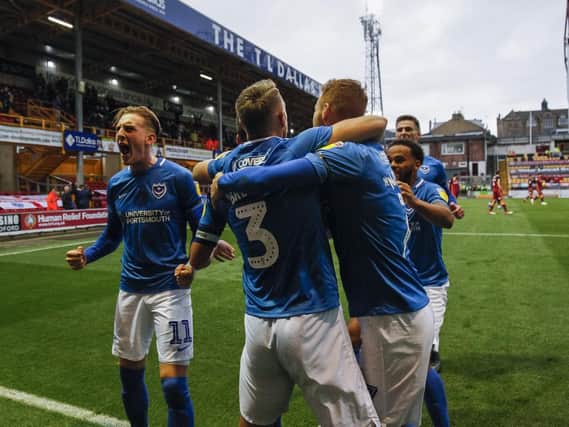 Pompey's Gareth Evans celebrates with teammates after scoring the goal. Picture: Daniel Chesterton/phcimages.com