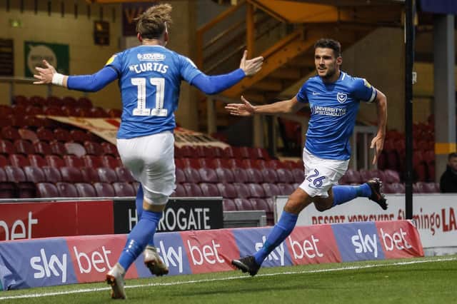 Gareth Evan selebrates with Ronan Curtis after netting Pompey's winner at Bradford. Picture: Daniel Chesterton