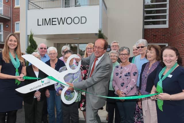 Fred Dinenage alongside staff and residents at the new Limewood Retirement Living development