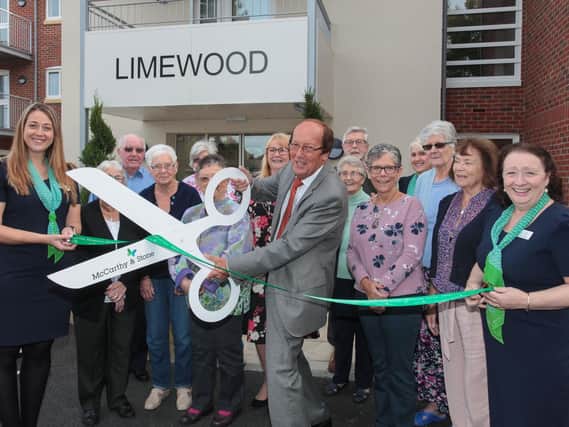 Fred Dinenage alongside staff and residents at the new Limewood Retirement Living development