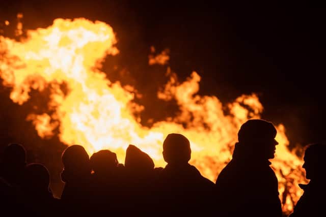 People silhouetted by the bonfire at the Wickham Fireworks display.
Picture: Keith Woodland