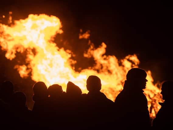 People silhouetted by the bonfire at the Wickham Fireworks display.

Picture: Keith Woodland
