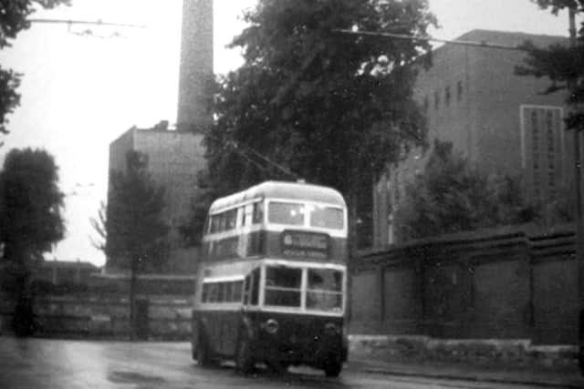 A wet Wednesday evening in June 1963 and a Burlingham trolleybus is dwarfed by Portsmouth power station. Picture: Barry Cox Collection