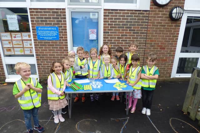 Pupils at Locks Heath Infant School selling reflective gadgets for road safety