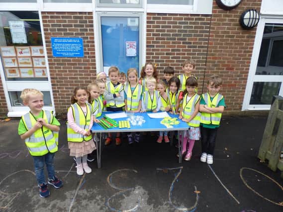 Pupils at Locks Heath Infant School selling reflective gadgets for road safety