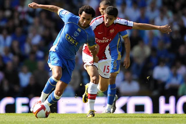 Arsenal's Neves Denilson (right) and Portsmouth's Jermaine Pennant battle for the ball. Picture: Daniel Hambury
