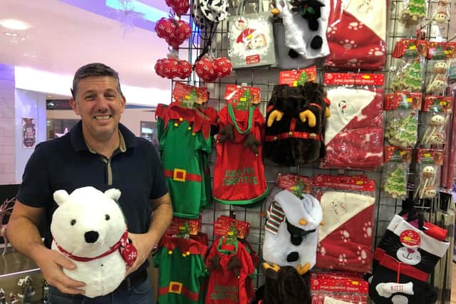 Stuart Mckeowen, who runs The Christmas Shop in Cascades Shopping Centre, with a polar bear head