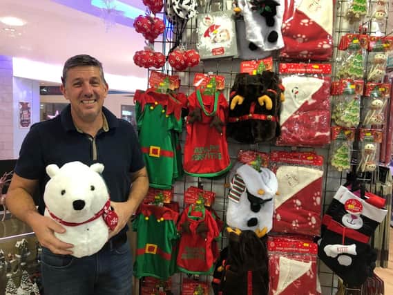 Stuart Mckeowen, who runs The Christmas Shop in Cascades Shopping Centre, with a polar bear head