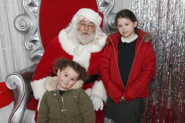 Bella, three, and her sister Lola, nine, with Santa in the Grotto in Cascades, Portsmouth.
Picture : Habibur Rahman