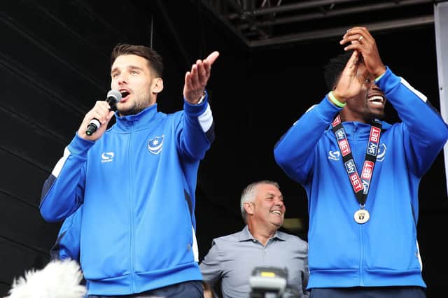 Gareth Evans takes on an impromptu singing role at Pompey's League Two title-winning celebrations. Picture: Joe Pepler