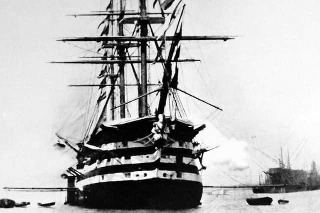 The magnificent 131-gun HMS Duke of Wellington dressed overall and firing a salute in Portsmouth Harbour, possibly 1897. Picture: PRDHS