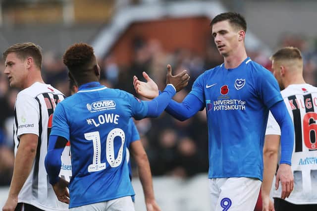 Oli Hawkins and Jamal Lowe celebrate another Pompey away win - this time in the FA Cup against Maidenhead United Picture: Joe Pepler