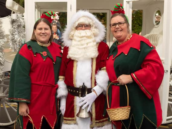 Santa with two of his helpers.

Picture Credit: Keith Woodland