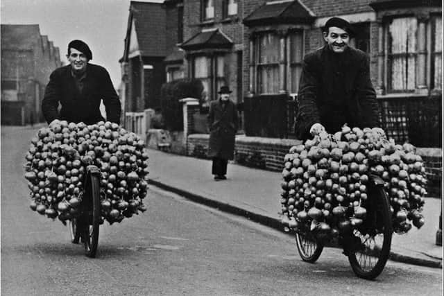 Onion sellers with their wares in a Portsmouth street in the 1950s. Can you recognise where they are? Picture: Philip Pyke Collection