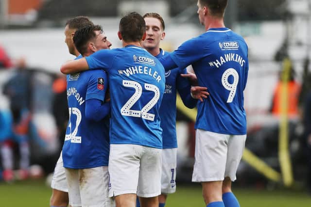 Pompey's players celebrate at Maidenhead on the way to an 11th match unbeaten on their travels. Picture: Joe Pepler