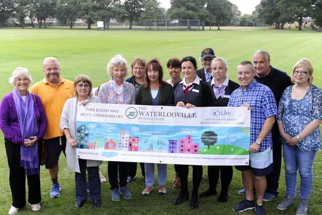 Made up of volunteers, The Waterlooville Events Team are working to bring the town centre back to life. Chairman Jackie Buckley is fourth in from the left. Picture: Malcolm Wells (180911-2547)