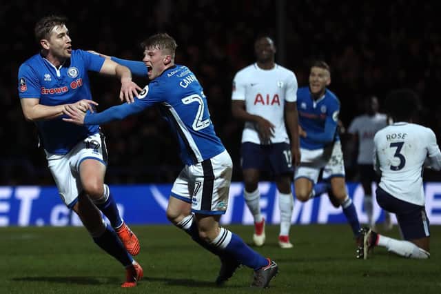 Rochdale's Steve Davies, left, celebrates scoring to earn a 2-2 draw against Spurs in the FA Cup. Picture: PA
