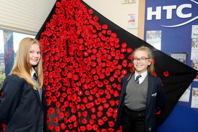 12/11/2018

Horndean Technology College held their Remembrance ceremony on Monday November 12.

Pictured is: (l-r) Jes Newman (12) and Ellie Cook (12).

Picture: Sarah Standing (180825-9791)
