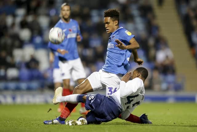 Haji Mnoga is challenged by Spurs Picture: Robin Jones