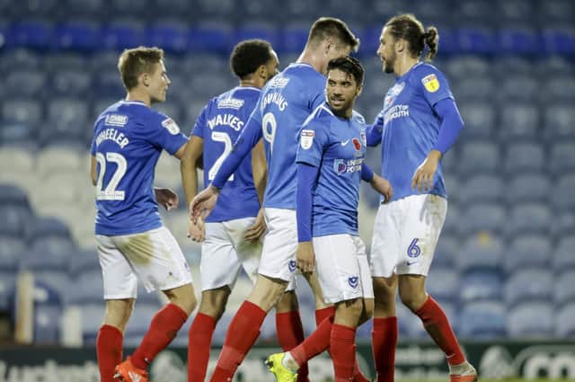 The Pompey players celebrated Oli Hawkins' goal in the victory over Spurs Picture: Robin Jones