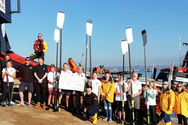 Members of the Tudor Sailing Club present cheque to Eastney RNLI