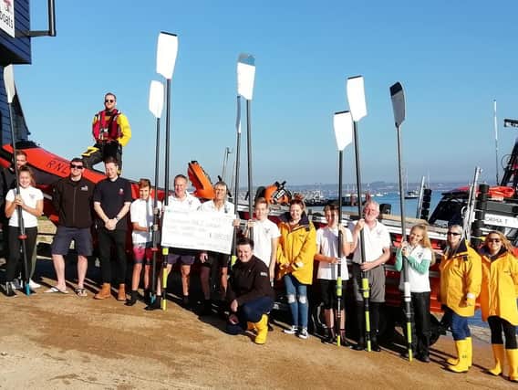 Members of the Tudor Sailing Club present cheque to Eastney RNLI