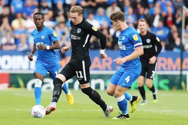 Martin O'Neill ran the rule over Ronan Curtis during Pompey's 2-1 victory over Peterborough. Picture: Joe Pepler