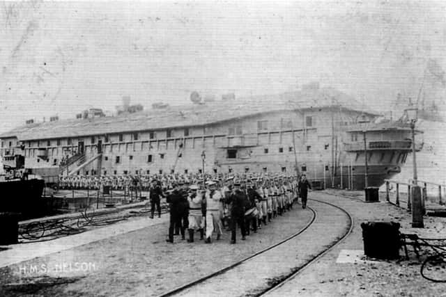Although looking like a wooden wall, here we see the Nelson-class armoured cruiser HMS Nelson in 1904. She was launched in 1876.