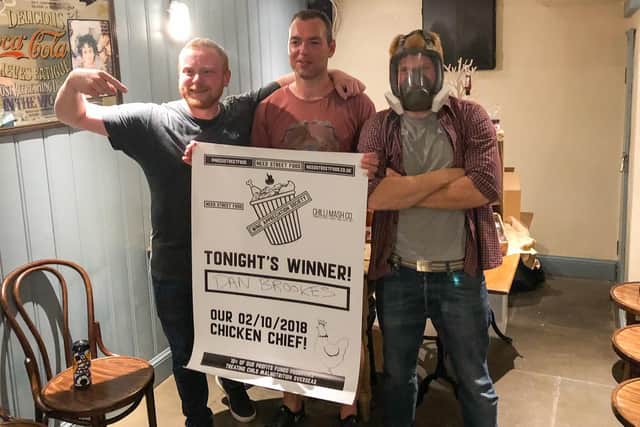 Dan Brookes, from Portsmouth, centre, who won the Chilli Mash Company chilli eating contest at The Merchant House Southsea