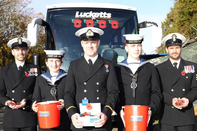 From left, PO Higgins, AET KAY, SLT Stevens,MA Bulmer-Lidsay and PO Piper in front of the Lucketts coach that transported personnel to London Poppy Day. Picture: PO Phot Nicola Harper