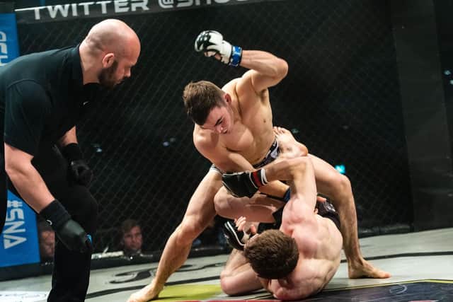 Shock N Awe 28 Mixed Martial Arts and Kickboxing at the Portsmouth Guildhall - Sam Gibson (Chichester's Madhatters MMA) above James McCormack (Xion MMA). Picture: Vernon Nash (180686-002)