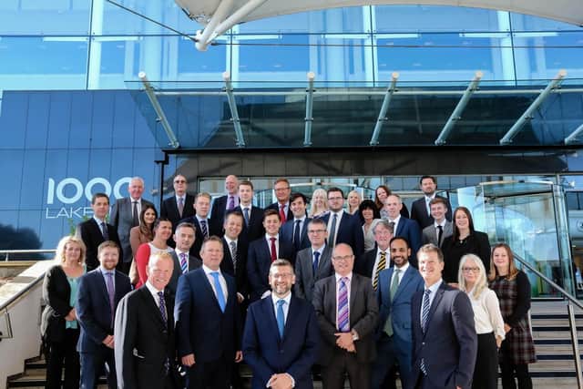 he Solent region team at commercial property consultancy Vail Williams, pictured outside 1000 Lakeside North Harbour, Portsmouth. Pictured front centre is Regional Managing Partner Mike Greenwood with Vail Williams Managing Partner Matthew Samuel-Camps on the right next to Mike. There are 50 in the multi-disciplinary team, with the office in Portsmouth and one at Savannah House, Ocean Village, Southampton. Vail Williams has been a resident at Lakeside North Harbour for five years.