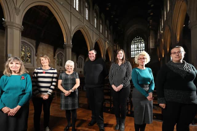 From left, Hilary Frost and Carole Price, both of Lifehouse Soup Kitchen, Lin Kitchener of the Roberts Centre, Father Bob White, Czarina Jacobs of Southern Domestic Abuse Service, Emma Adams of Portsmouth Churches Housing Association, and Rachel Mason of Two Saints housing charity, pictured at the Christmas Voucher Campaign launch, St Mary's Church, Fratton. Picture: Chris Moorhouse