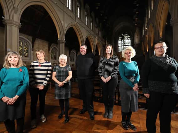 From left, Hilary Frost and Carole Price, both of Lifehouse Soup Kitchen, Lin Kitchener of the Roberts Centre, Father Bob White, Czarina Jacobs of Southern Domestic Abuse Service, Emma Adams of Portsmouth Churches Housing Association, and Rachel Mason of Two Saints housing charity, pictured at the Christmas Voucher Campaign launch, St Mary's Church, Fratton. Picture: Chris Moorhouse