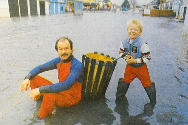 Alan Lawrence and Buzz Hill, of Sandy Point Road, Hayling Island, posed for the camera during the floods.