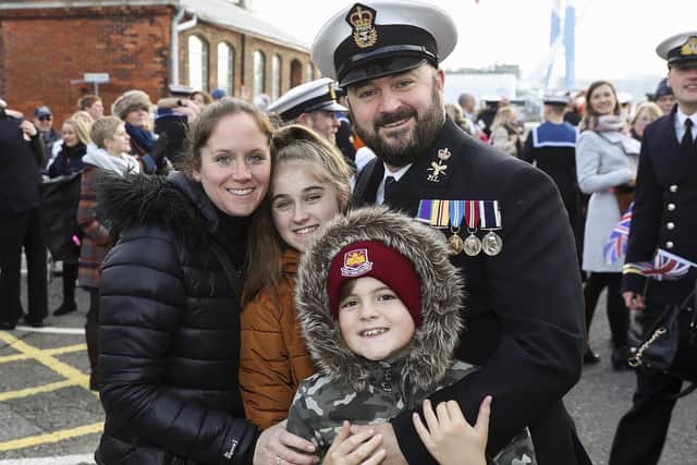 Pictured here are a family reunited upon the return of HMS Diamond to Portsmouth.