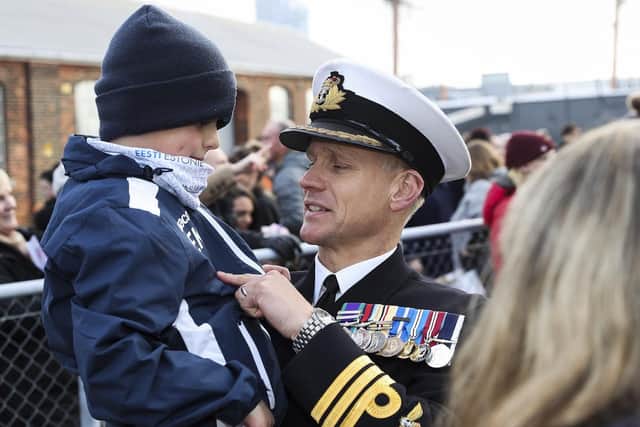 Commander Ben Keith, the CO of HMS Diamond greeting his family as he disembarks the ship as it arrives in Portsmouth