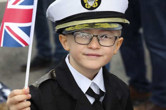 Pictured is Owen Ellaway dressed up in naval attire awaiting the return of his father on HMS Diamond.