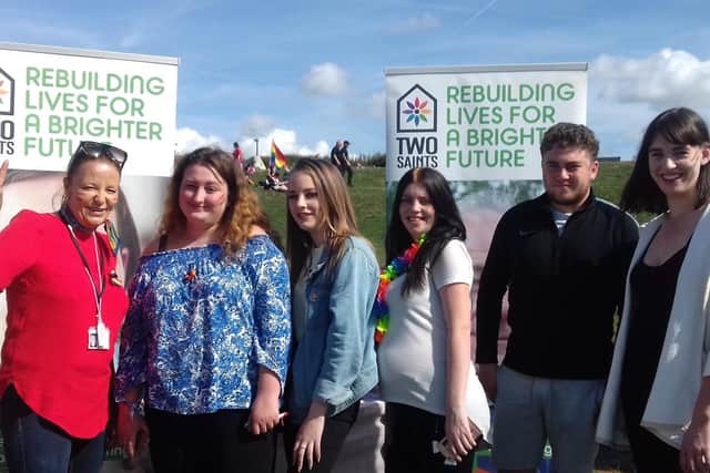 Community support worker Laura Davis, four young people from Portsmouth Foyer and support worker Megan Penney at Portsmouth Pride. Picture: Two Saints