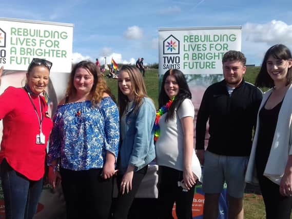 Community support worker Laura Davis, four young people from Portsmouth Foyer and support worker Megan Penney at Portsmouth Pride. Picture: Two Saints
