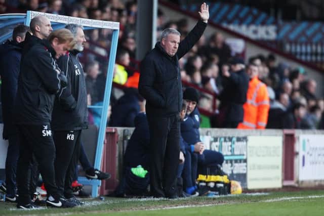 Kenny Jackett acknowledges the Pompey fans at Scunthorpe / Picture by Joe Pepler