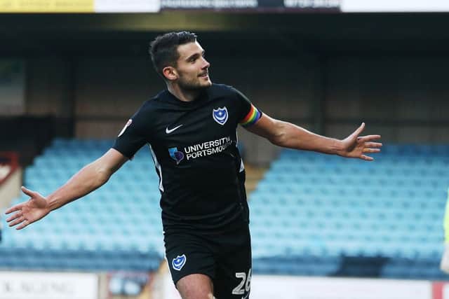 Gareth Evans celebrates putting Pompey on their way to a maiden victory at Glanford Park. Picture: Joe Pepler/Digital South.