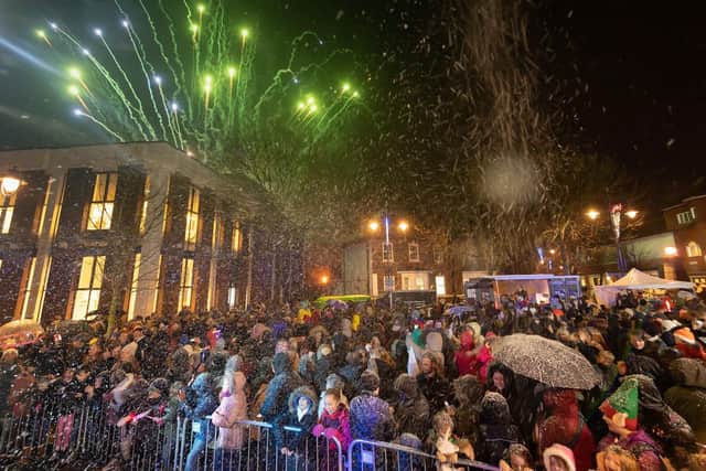 The audience watch the fireworks whilst sprayed with snow.
Picture: Keith Woodland