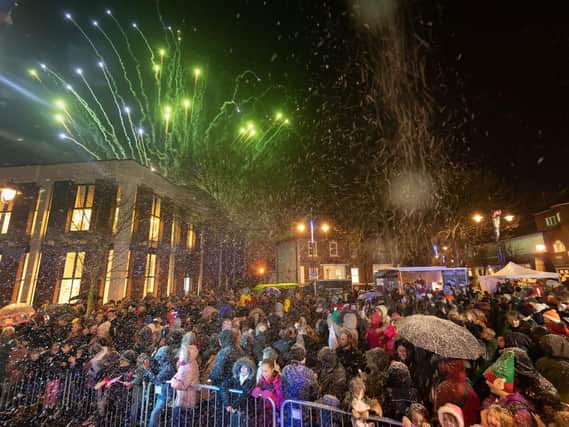 The audience watch the fireworks whilst sprayed with snow.

Picture: Keith Woodland
