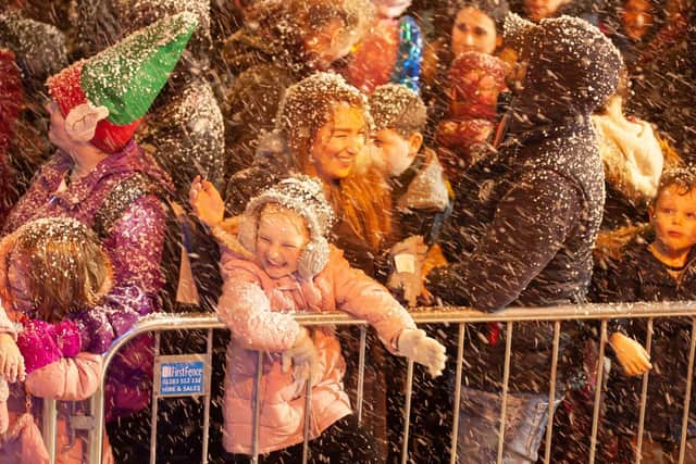 The audience at the Gosport lights switch-on gets sprayed with snow. Picture: Keith Woodland