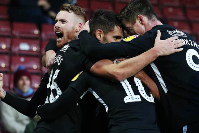 Pompey celebrate Gareth Evans' goal at Scunthorpe. Picture: Joe Pepler